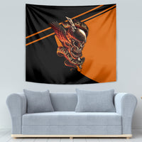 Black and orange wall-hanging skull tapestry with fiery winged artwork and stripes