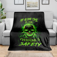 Black throw blanket with neon green flame skull and jagged text graphic