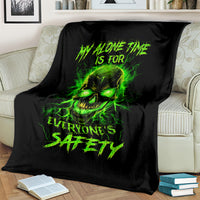 Black blanket with neon green flame skull front graphic and slogan text
