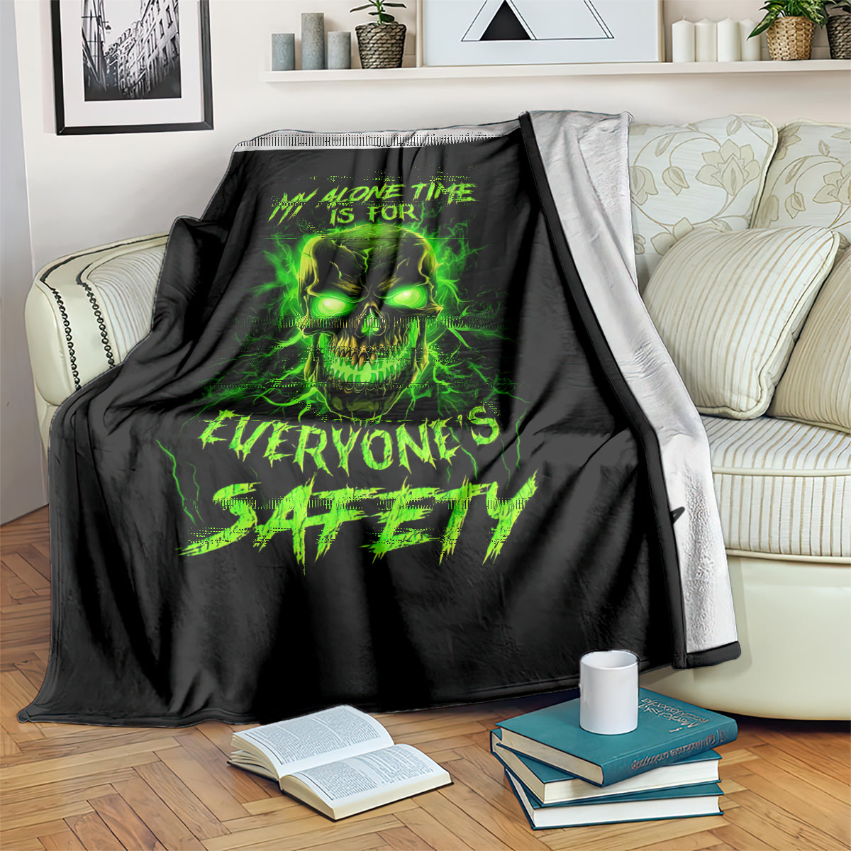 Black throw blanket with neon green flame skull design and bold slogan text