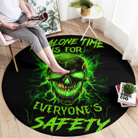 Black round area rug with neon green skull graphic and phrase 'ALONE TIME IS FOR'