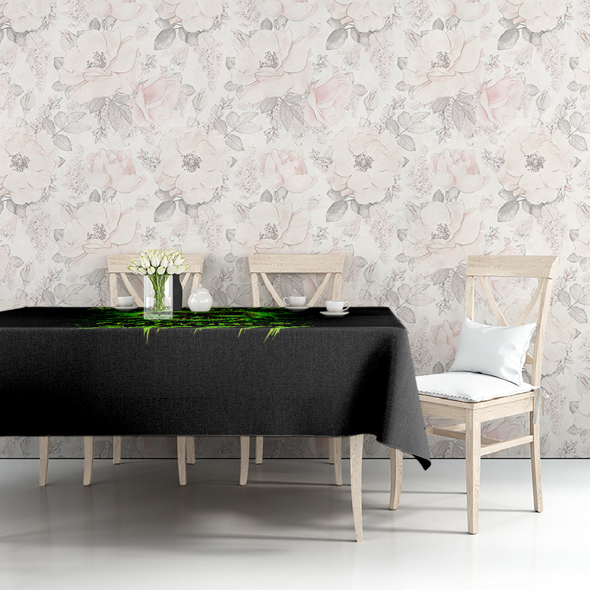 Black tablecloth on dining table with neon green flame skull graphic along the edge.