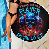 Black round beach blanket with blue-red skull artwork and "Nice to meet you I'm the coach"