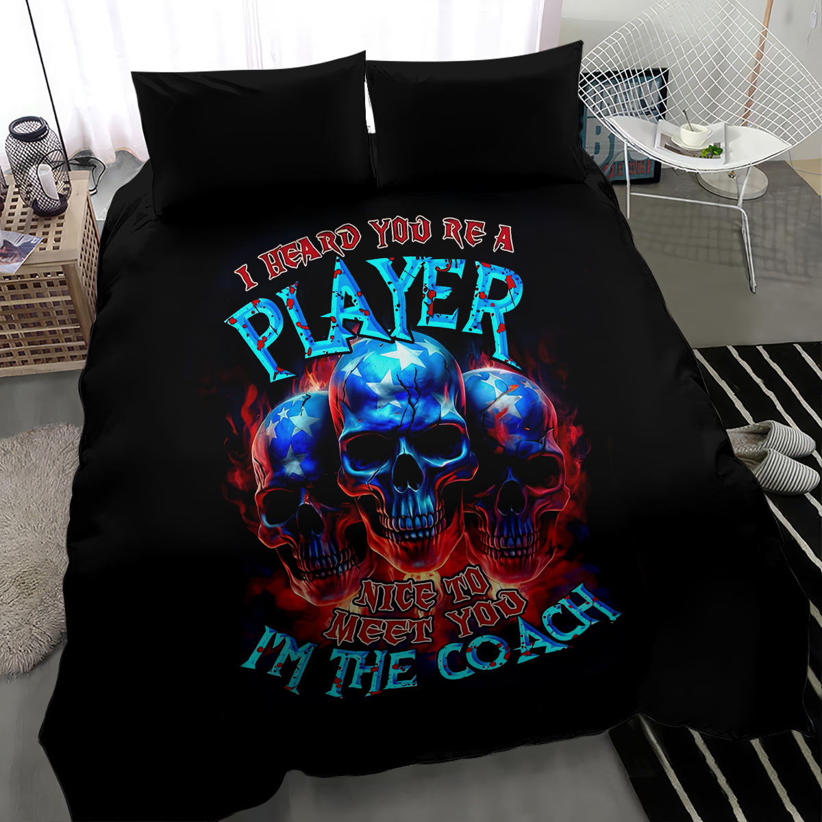 Black bedding set with blue skull and "I'm the coach" typography on duvet and pillows