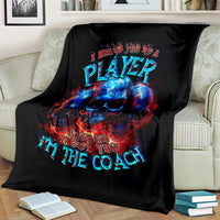 Black skull graphic blanket with PLAYer and Nice to meet you text on couch