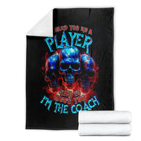 Black skull graphic blanket with PLAYer and coach text, neatly packaged with folded towels