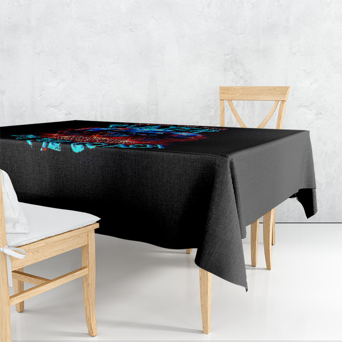 Black skull tablecloth with colorful graphic band across the corner.
