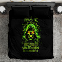 Black bedding set flat lay with neon green skull and text graphic on duvet