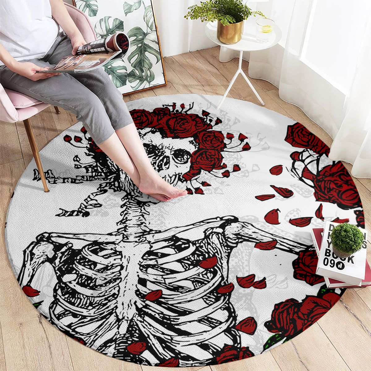 Round area rug with skull portrait and red roses on a white background