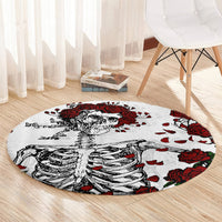 Round area rug with skull and skeleton illustration, red rose clusters on white