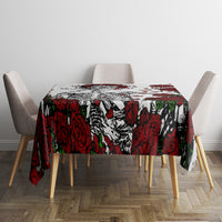 Square skull and rose print tablecloth on dining table, red roses and black skulls
