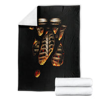 Black flame skull skeleton inside body blanket folded with white towels