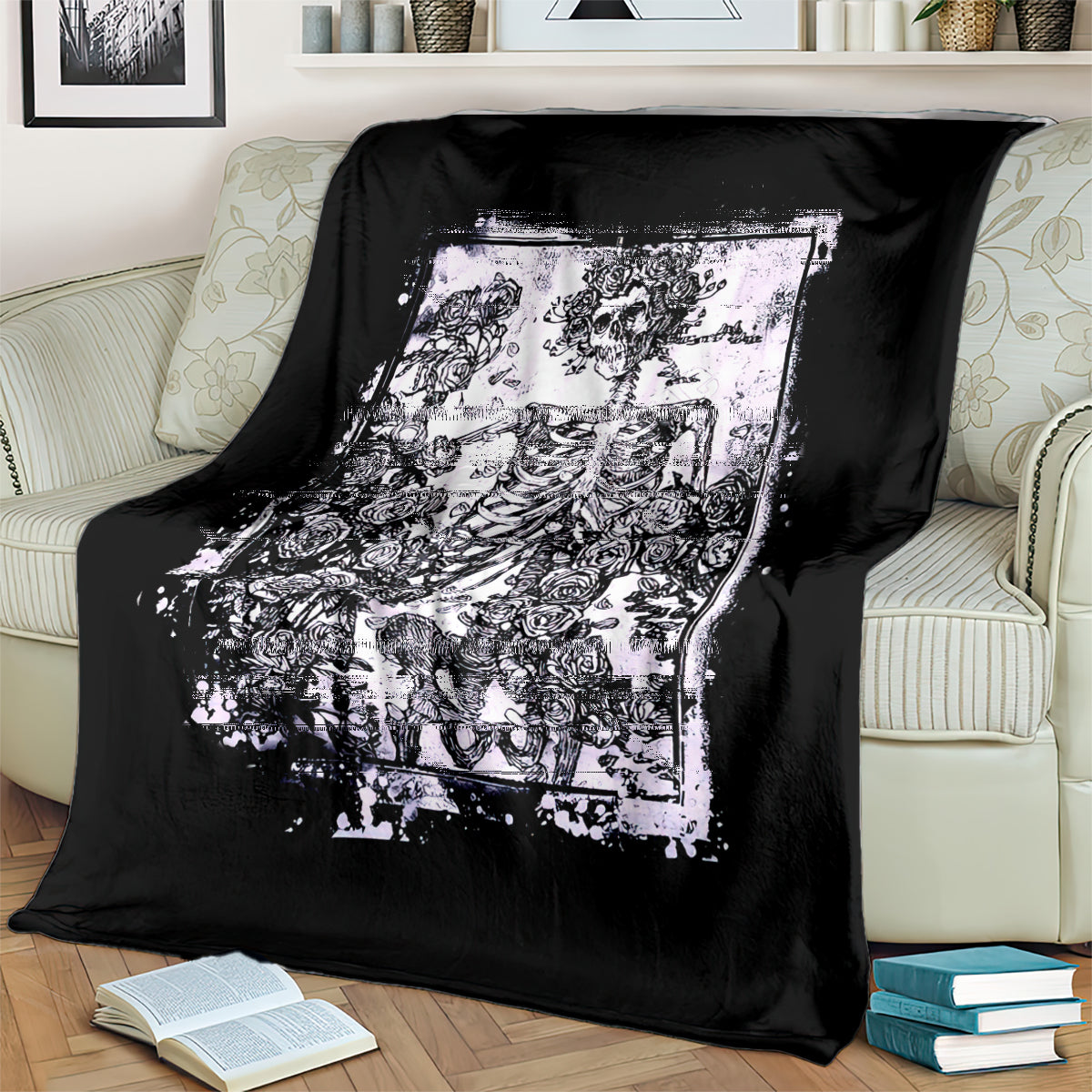 Black skull and rose blanket draped on a sofa, large white graphic panel