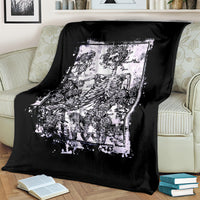 Black skull and rose blanket draped on a sofa, large white graphic panel