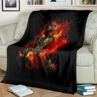 Black skeleton fire skull blanket with bright red and orange flame print