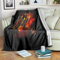 Black skeleton fire skull blanket draped on striped armchair