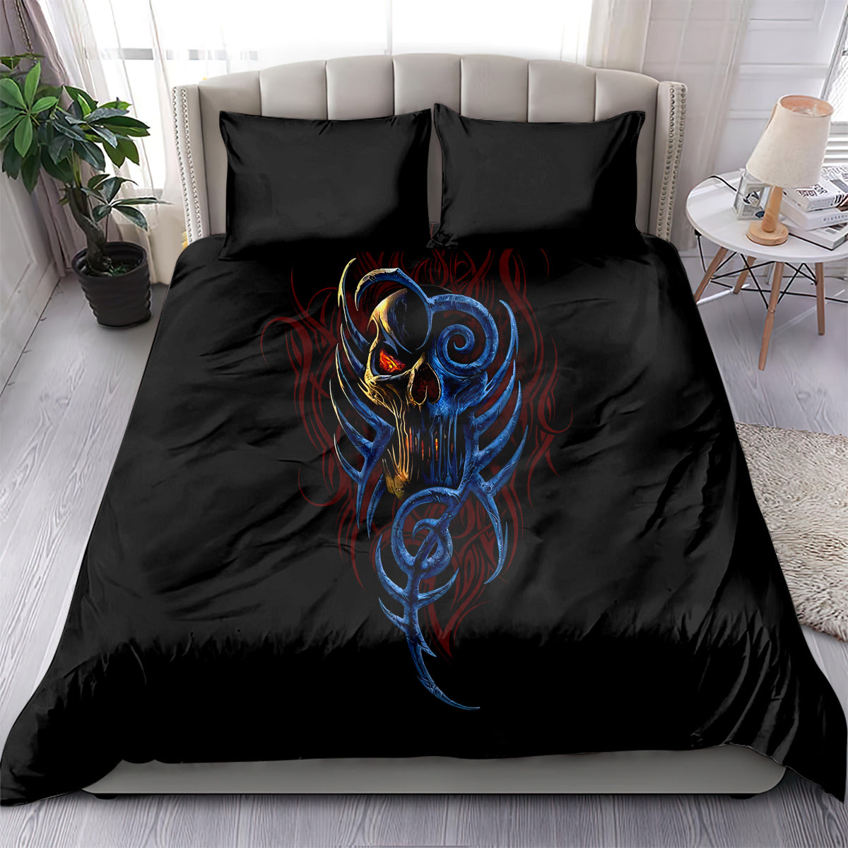 Black bedding set on bed with devil skull face graphic and two matching pillowcases