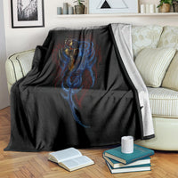 Black devil skull blanket with blue and red flame-like details, draped over couch
