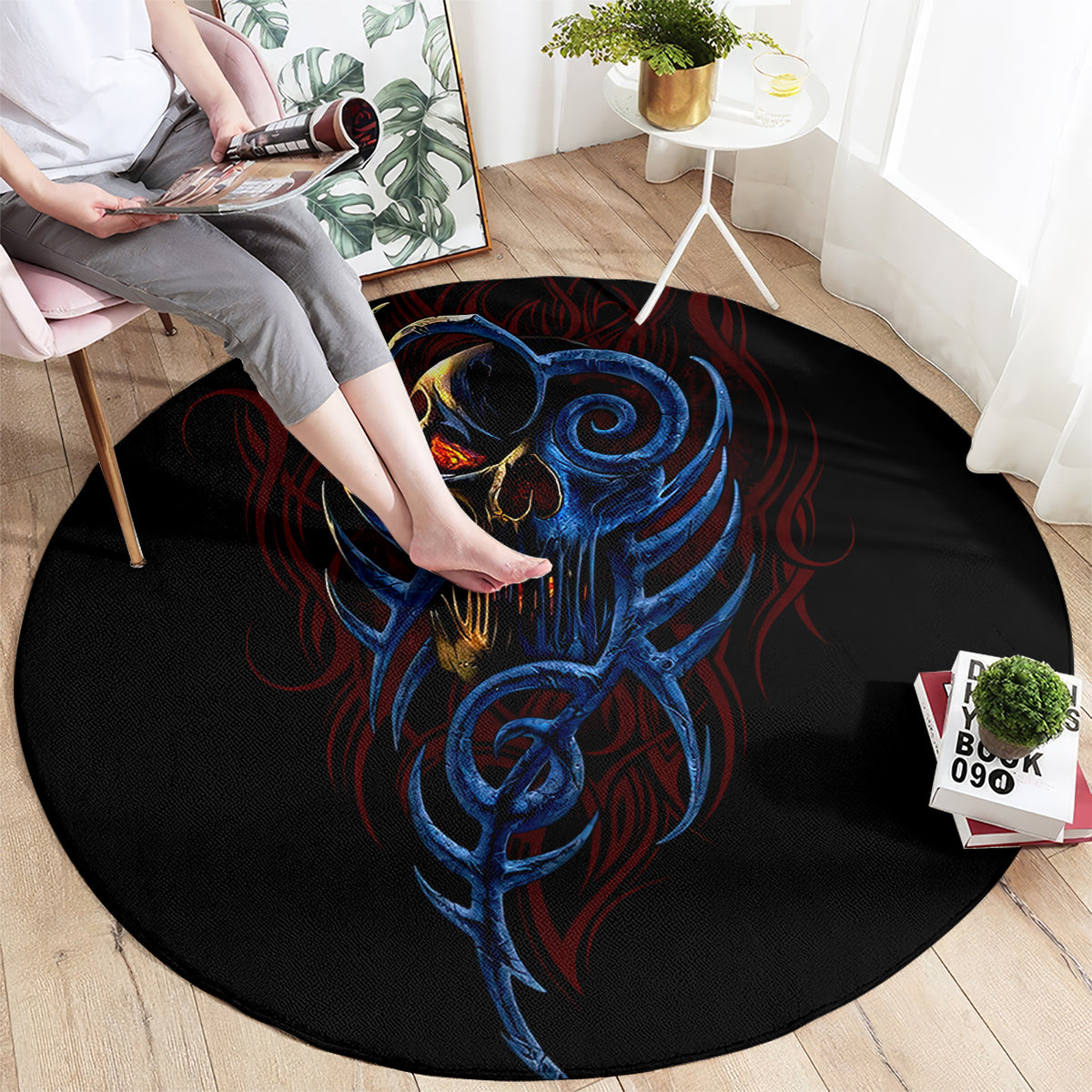 Round black devil skull rug with blue screaming face and red accent swirls