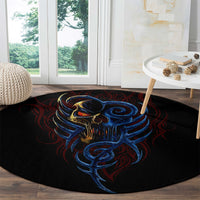 Round black rug featuring blue devil skull with red tendril-style graphics