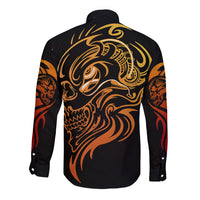 Black long-sleeve button shirt with gold skull face tattoo graphic on back