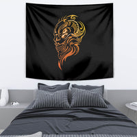 Black tapestry with golden skull face design hanging above bed