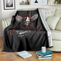 Black skull and wings blanket with red roses and flames, draped over seating