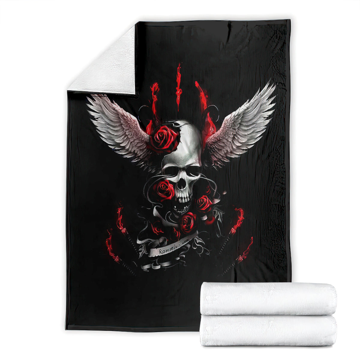 Black skull and wings blanket with red roses and flames, laid out with rolled towels