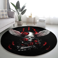 Round black rug with skull, red floral roses, and symmetrical silver wings