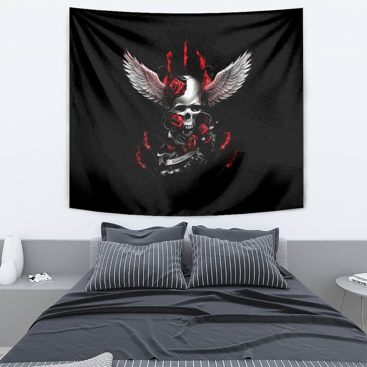 Black skull wings tapestry draped above bed, red roses and flame artwork.