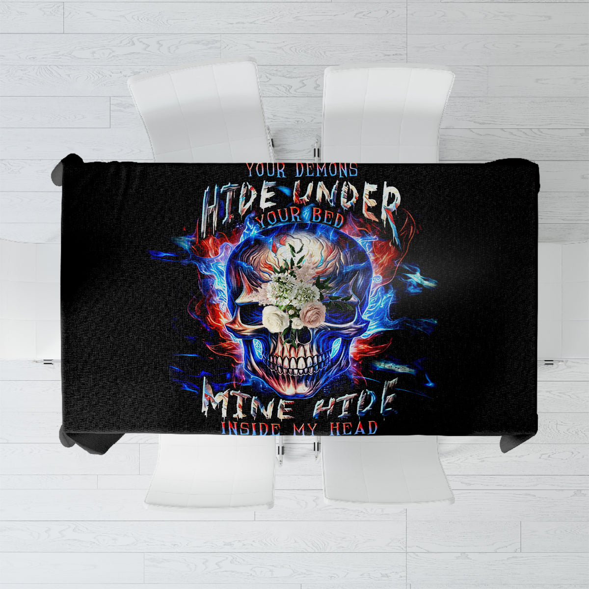 Black tablecloth featuring a blue-red flaming skull graphic centered on table
