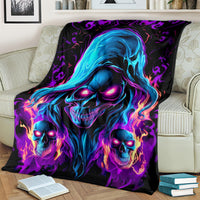 Black skull flame fleece blanket with close-up blue hooded skull and three flaming skulls