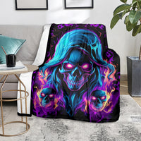 Black skull flame fleece blanket with blue hooded skull portrait and three glowing skulls