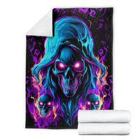 Black skull flame fleece blanket folded with blue hooded skull face and flaming skull trio