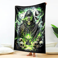 Black decorative blanket featuring a hooded reaper skeleton, skulls, and green flames