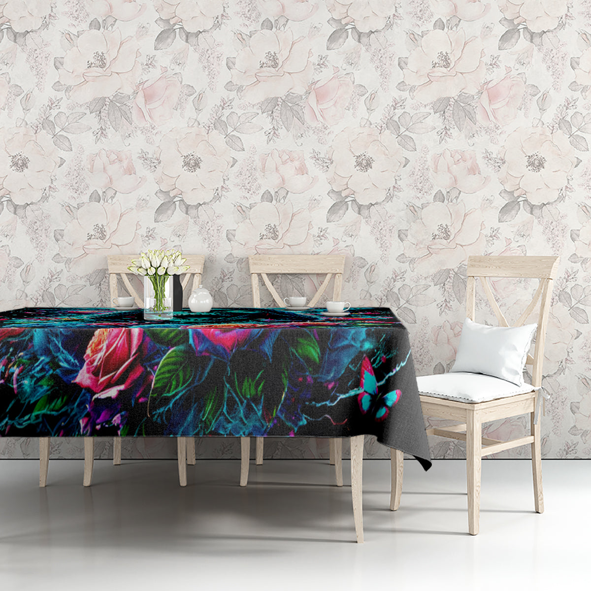Black tablecloth with bright skull-and-rose print and butterfly detail, neatly draped