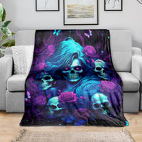Blue-haired skulls and roses fleece blanket draped over sofa