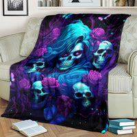 Fantasy skull and rose blanket in purple, blue, and black tones on couch