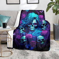 Skull rose graphic throw blanket with vivid blue-purple artwork on armchair