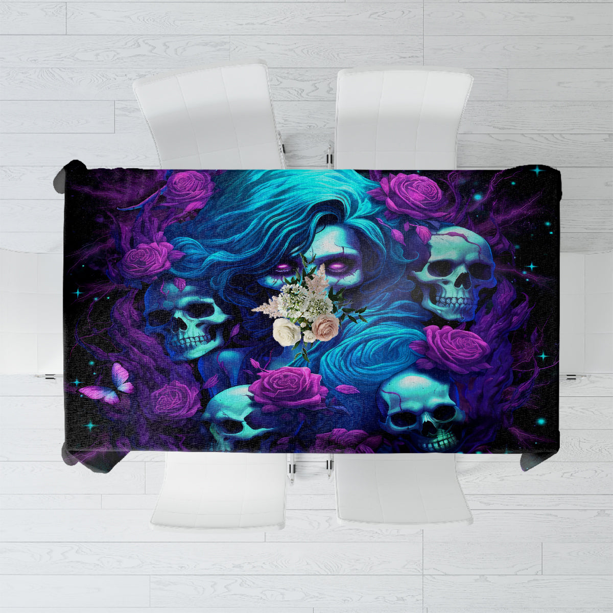 Black tablecloth with colorful skulls, roses, and swirling faces graphic.
