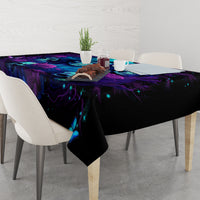 Black tablecloth draped over dining table with starry purple-blue skull rose print.