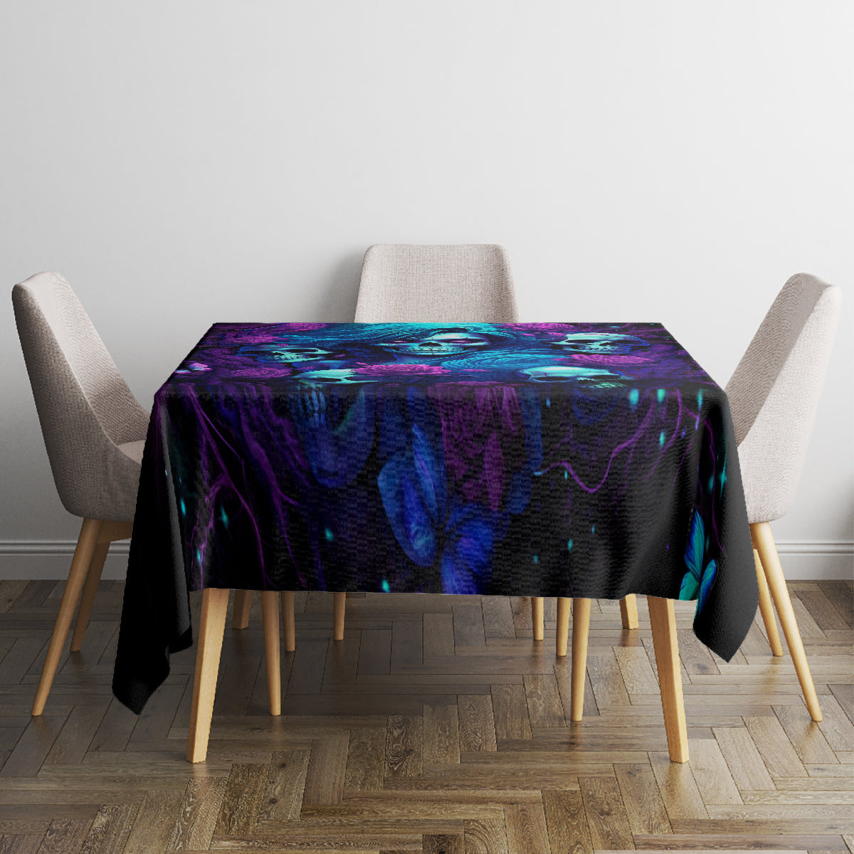 Black tablecloth on square dining table with purple-blue skull and rose pattern.