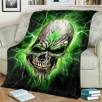 Black and green skull lightning blanket draped on a couch arm