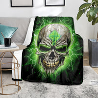 Black and green skull lightning throw blanket spread on a living room floor