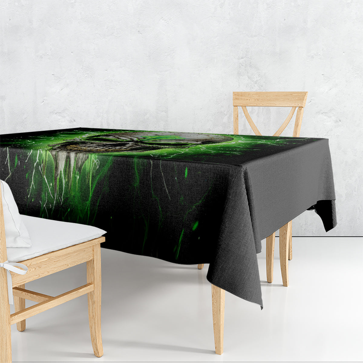 Black tablecloth draped over table with green lightning skull design