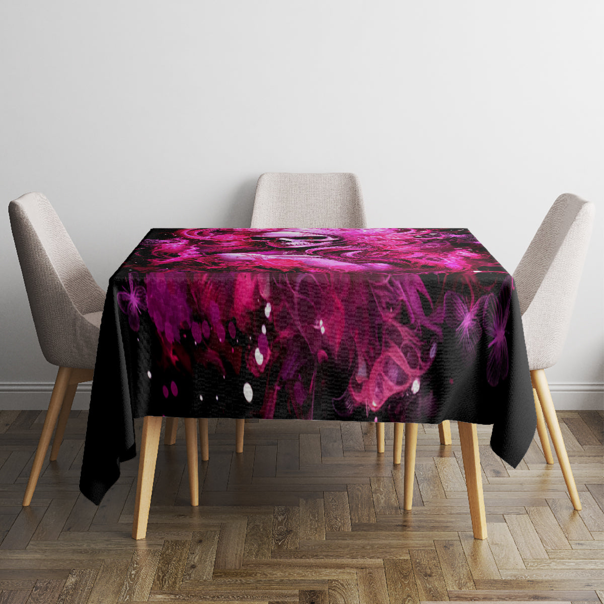 Black tablecloth with purple skull-lady splash graphic on rectangular table, hem visible