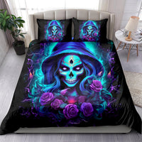 Black duvet and 2 pillowcases with large blue-purple skull lady face and roses.