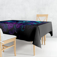 Black tablecloth with purple-blue skull and rose design, draped on dining table