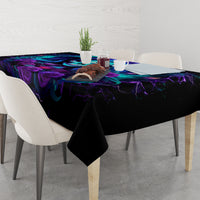 Black tablecloth with purple-blue skull and rose graphic on dining table
