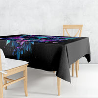Black skull-and-wings tablecloth draped over a table, purple and blue design